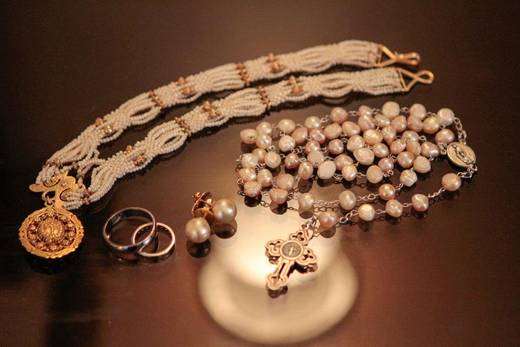 Rosary was given to the bride by maid of honor, Frances Solinap; bride held it while holding her bouquet.
