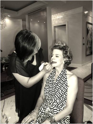 The distinct cool streaks of skilled makeup artist’s Cecile Rebollos’ hair as she preps Kevyn for her next big show.
